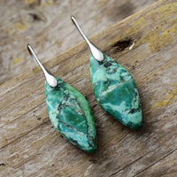 Green Imperial Jasper Leaf Dangle Earrings on wooden surface - women's earrings - ALLORA JADE