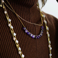 Model wearing purple Amethyst and seed bead necklace. ALLORA JADE