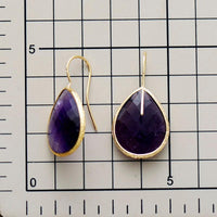 Faceted Amethyst gemstone earrings – elegant teardrop design - displayed on size chart background - Allora Jade