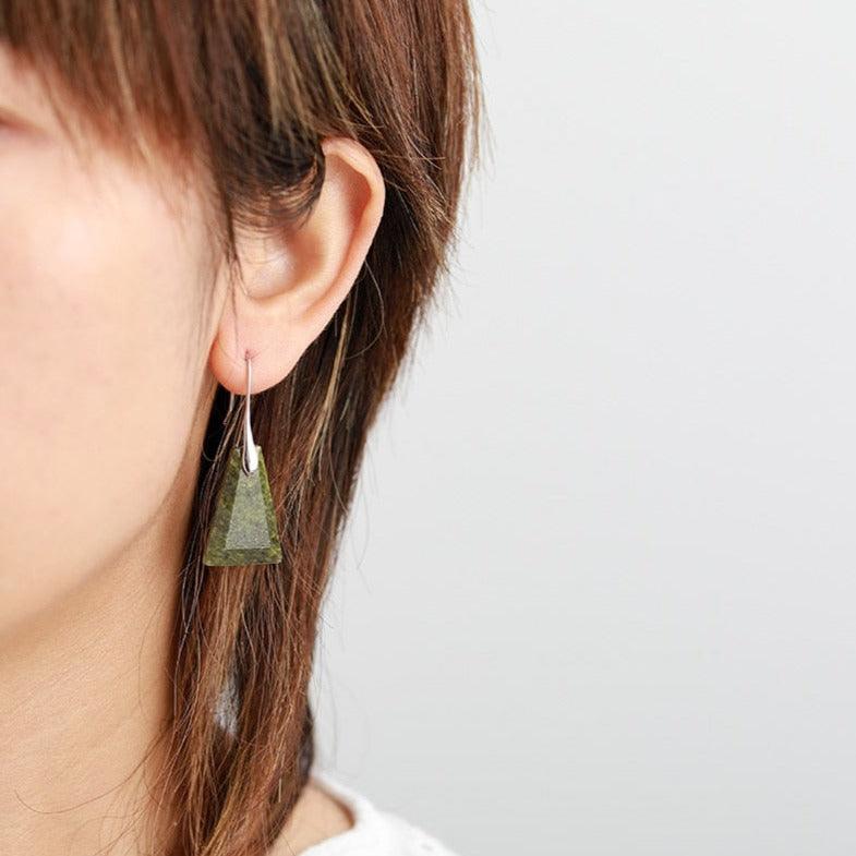 Model wearing Green Jasper Ascend Earrings – olive-green gemstone dangle earrings with silver hooks. ALLORA JADE