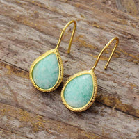 Amazonite Radiance Teardrop Earrings on wooden surface – boho chic style. | ALLORA JADE