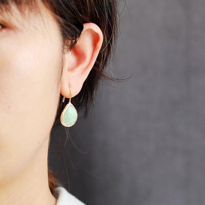 Amazonite Radiance Teardrop Earrings worn – faceted green crystal in gold frame. | ALLORA JADE