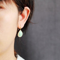 Amazonite Radiance Teardrop Earrings worn – faceted green crystal in gold frame. | ALLORA JADE