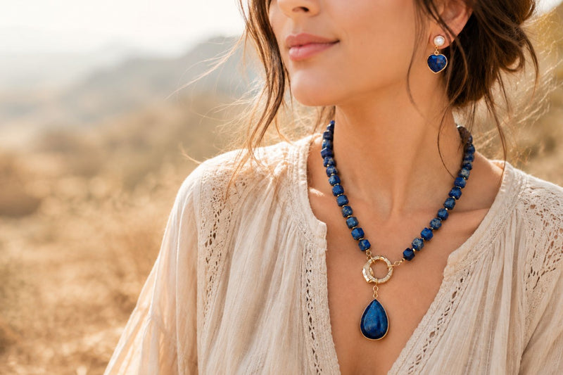 Women wearing Lapis Lazuli beaded pendant necklace and Lapis Lazuli drop earrings. 