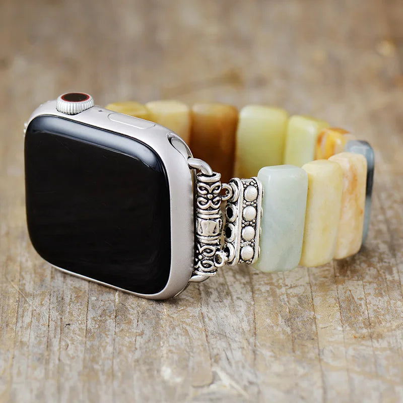 Smartwatch with a decorative band on a wooden surface. Amazonite Stretchy Apple Watch Band | ALLORA JADE