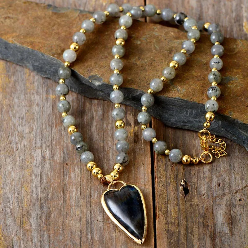 Necklace with heart-shaped pendant on a wooden surface