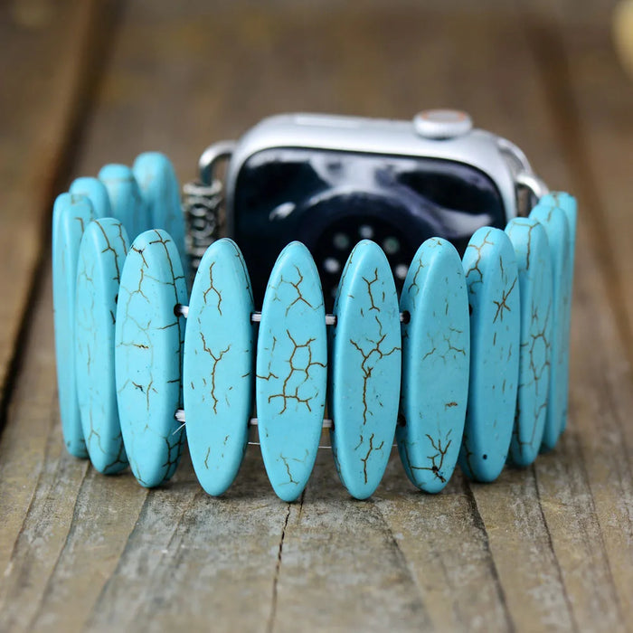 Turquoise stone bracelet on a wooden surface. Turquoise Beads Stretchy Apple Watch Band | ALLORA JADE
