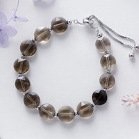 Necklace with smoky quartz beads on a light background