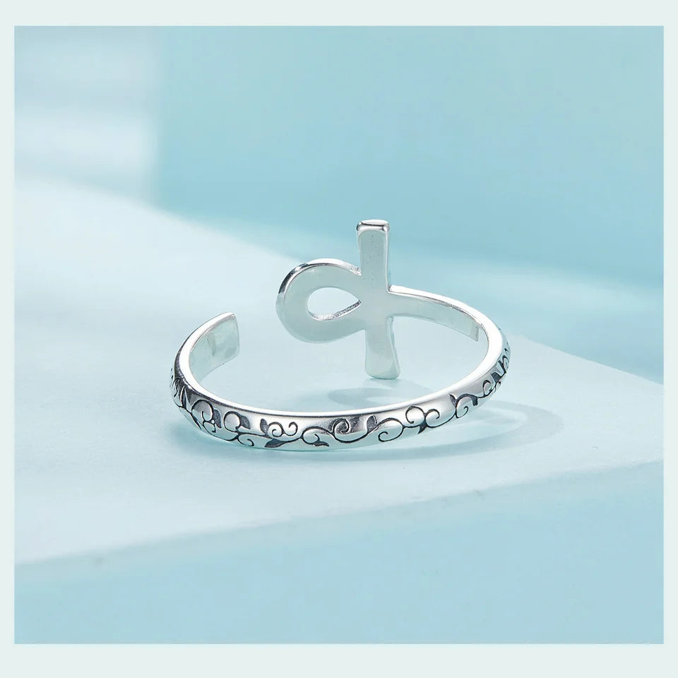 Ankh Egyptian Cross Sterling Silver open ring with decorative design on a light blue background