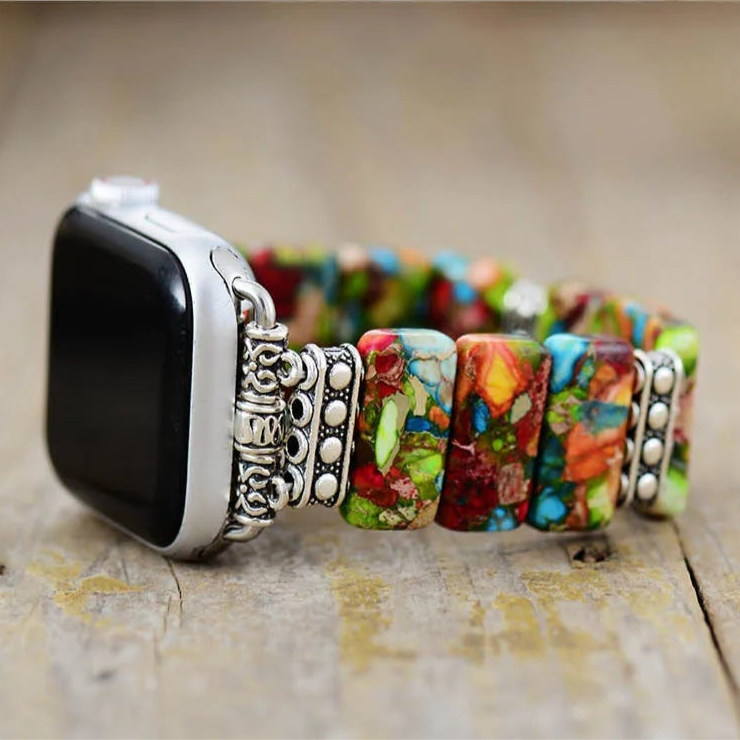 Colourful beaded bracelet with a silver clasp on a wooden surface. Flower Jasper Stretchy Apple Watch Band | ALLORA JADE