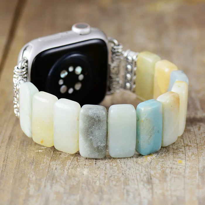Smartwatch with a beaded bracelet on a wooden surface. Amazonite Stretchy Apple Watch Band | ALLORA JADE