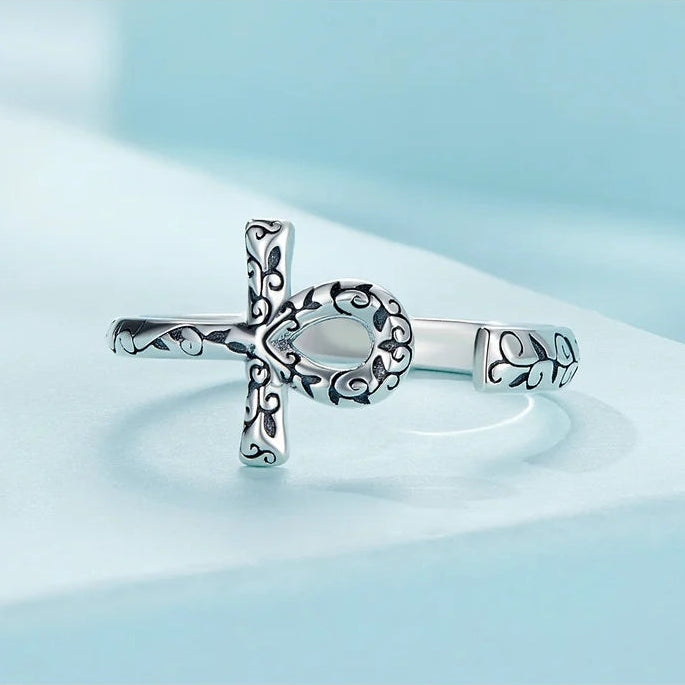 Ankh Egyptian Cross Sterling Silver Ring with intricate design on a light blue background