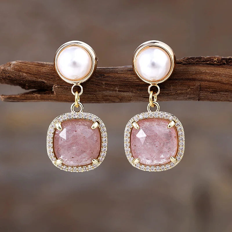 Strawberry Quartz Pavé Cushion Dangle Earrings featuring rosy-pink gemstone drops framed by sparkling rhinestones, with imitation pearl studs in gold-coloured settings.
