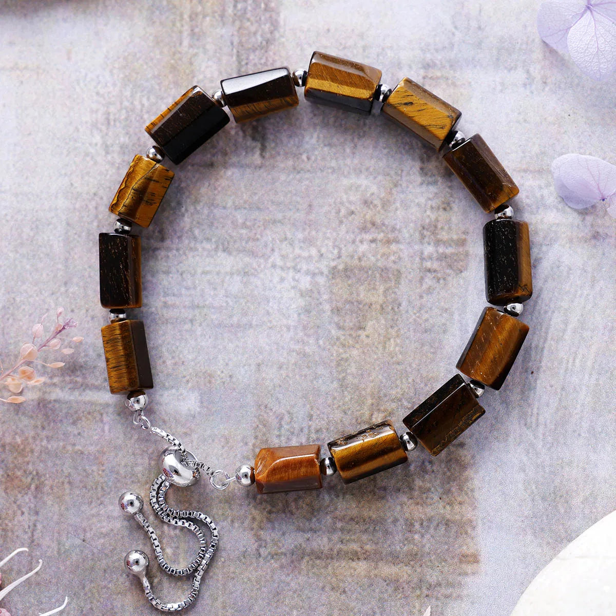 Bracelet with brown beaded design on a textured surface