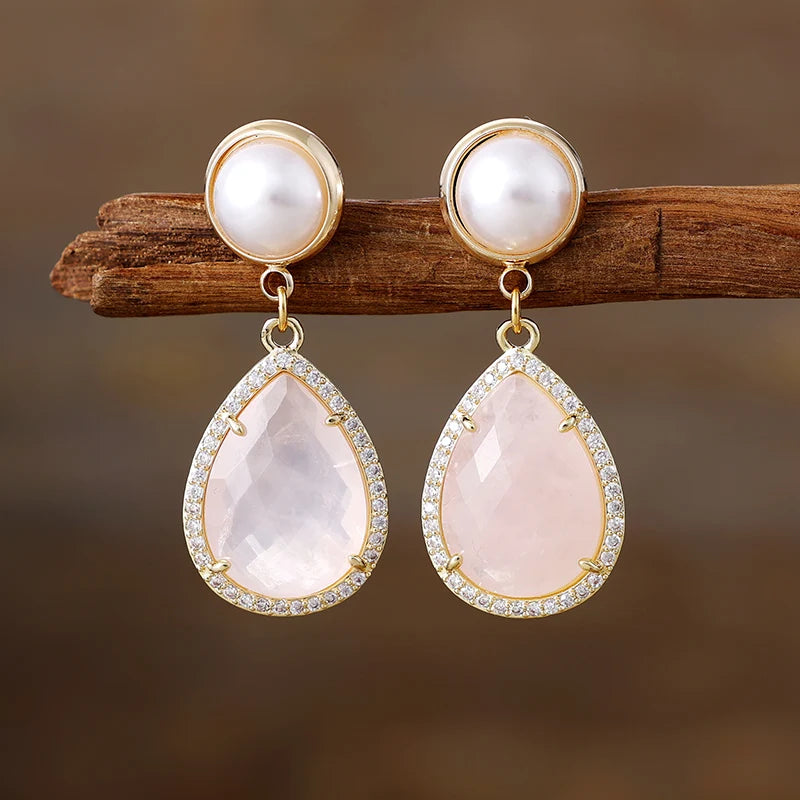 Rose Quartz Pavé Teardrop Dangle Earrings featuring soft blush-pink gemstone drops framed by sparkling rhinestones, with imitation pearl studs in gold-coloured settings.