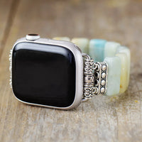Smartwatch with a decorative band on a wooden surface. Amazonite Stretchy Apple Watch Band | ALLORA JADE